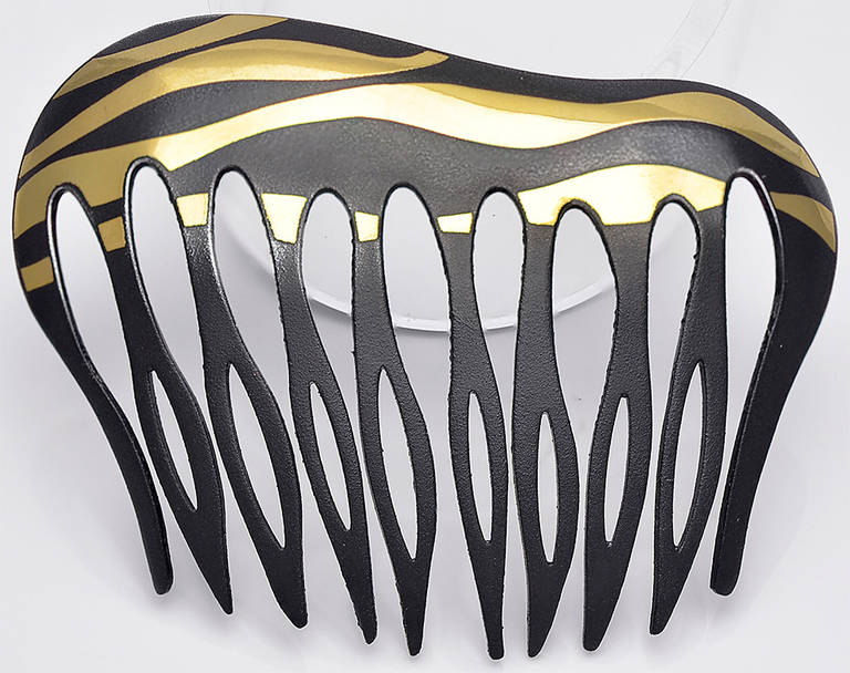 Estate pair of 18k gold and steel hair combs, made and signed by Angela Cummings. Very striking original design. Great look for that special occasion