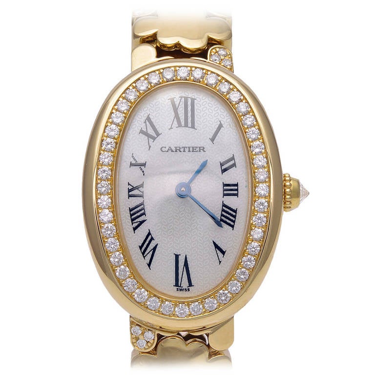 Elegant Cartier Baignoire watch, 18k rose gold with diamond bezel. This gorgeous diamond-set band was discontinued in 2009. Precision quartz movement. Opalescent mother-of-pearl face with Roman numerals.
Pristine condition.