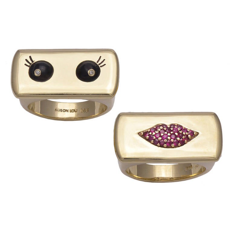 Heavy yellow bar 14K gold rings by Alison Lou. The black enamel eyes are set with a single sparkling diamond. The pouty lip ring is set with pave  rubies.
These rings stand on their own, but are fabulous when stacked to create a 