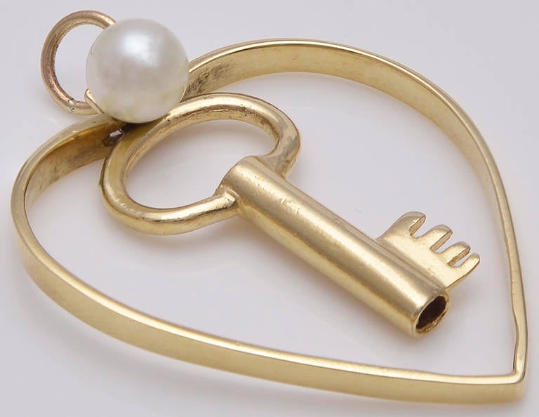 Figural Key To My Heart charm. 14K yellow gold, set with a pearl.
Fun charm for Valentines Day