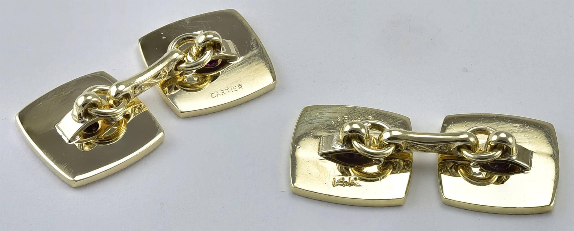 Most handsome double-sided cufflinks.  Made and signed by CARTIER. Deeply carved deco line pattern with a faceted center ruby. 14K yellow gold. Exceptionally attractive and well-done.

Alice Kwartler has sold the finest antique gold & diamond
