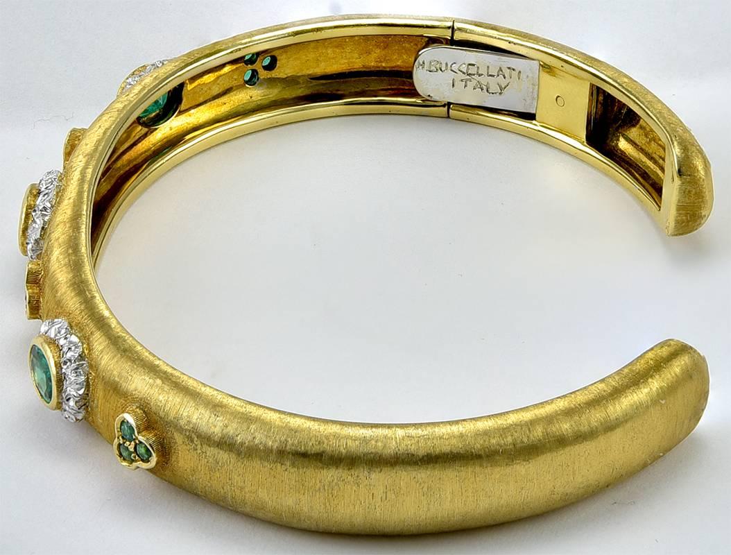 Hinged bangle bracelet. Made and signed by Mario Buccellati. 18K yellow and white gold. Set with faceted emeralds. Fits an average size1 wrist. A beauty.

Alice Kwartler has sold the finest antique gold & diamond jewelry and silver for over 40