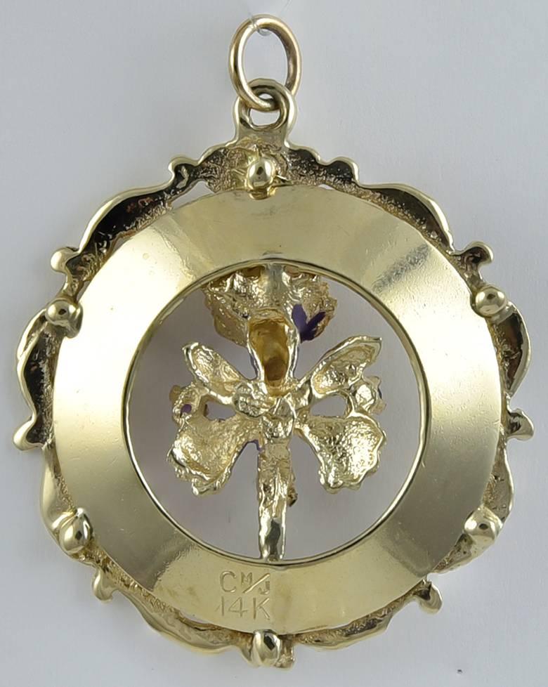 Large pendant/charm which says 