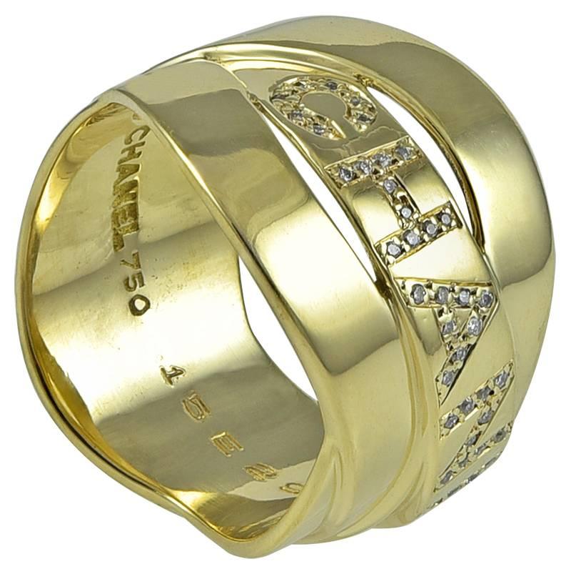 Wide overlapping band ring.  Made and signed by Chanel.  18K yellow gold.  