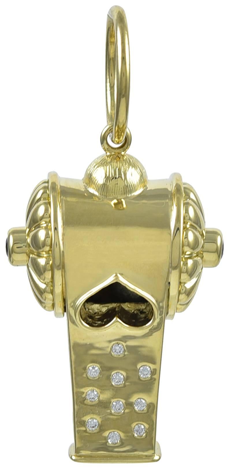 Striking figural whistle. Set in heavy gauge 18K yellow gold, with ten brilliant diamonds and two bright faceted rubies. 1-1/2