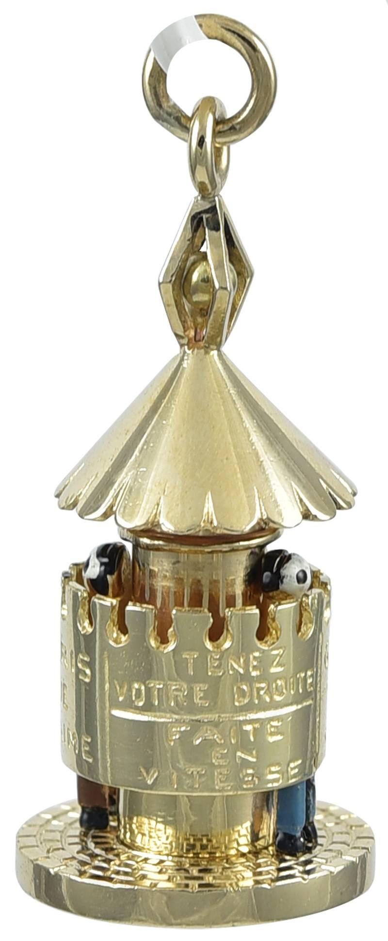 Unusual figural charm relating to Paris cinema. Center section revolves and is engraved: 