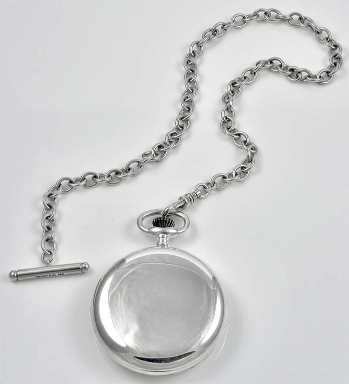 silver pocket watch and chain