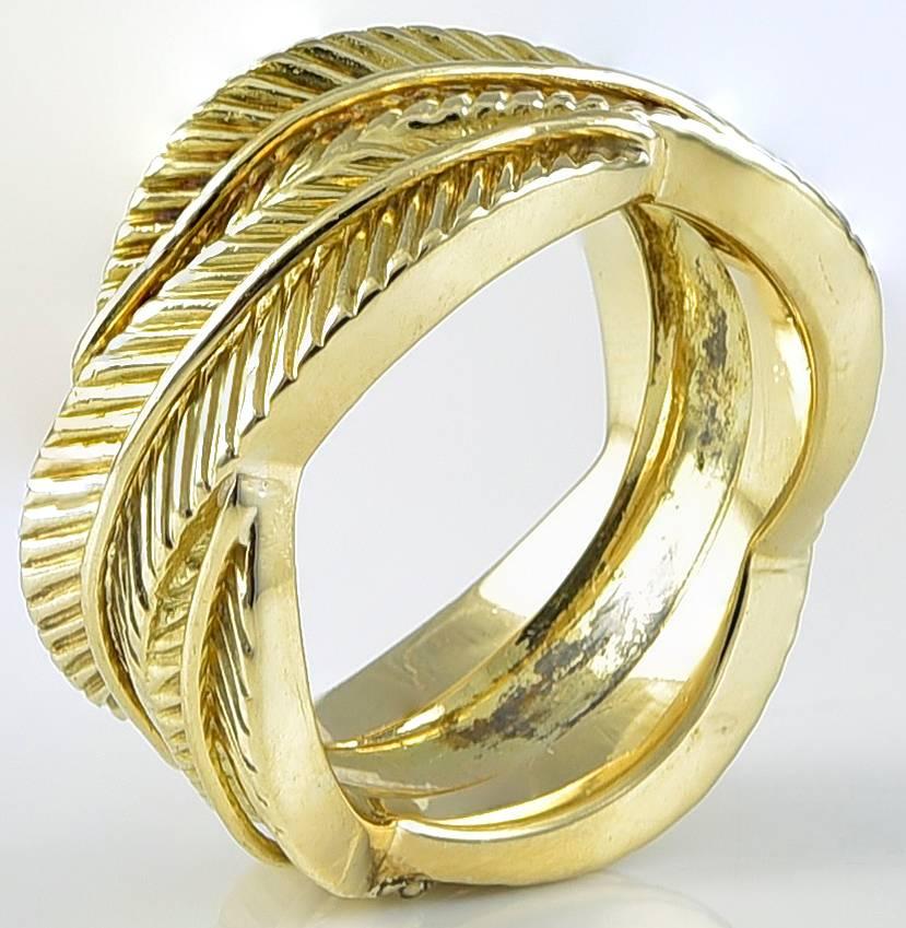Outstanding wide eternity band. Made & signed by Van Cleef & Arpels. Heavy gauge 18K yellow gold intertwined leaf pattern. Size 6. Looks and feels beautiful, like a piece of sculpture. A special ring.

Alice Kwartler has sold the finest antique