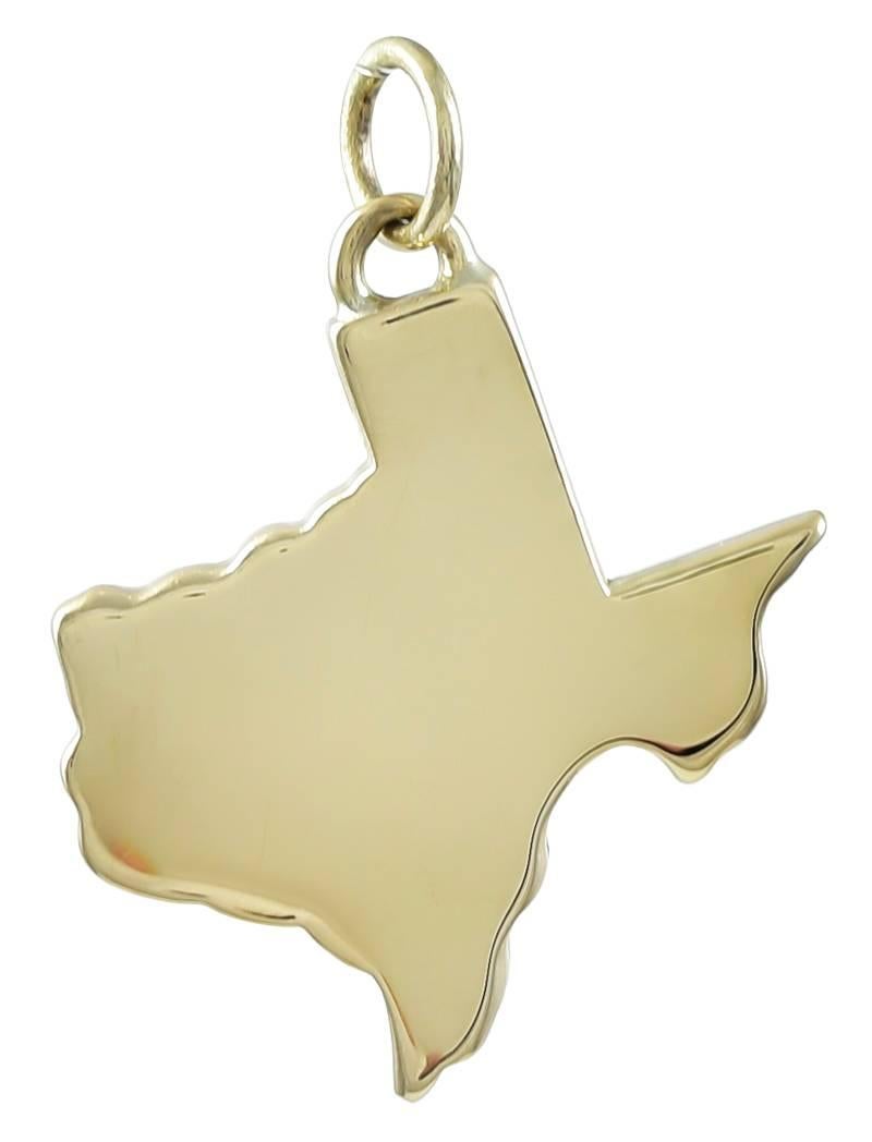Figural state of Texas charm. 14K yellow gold.   Shiny on one side, textured on the other. 1-1/8