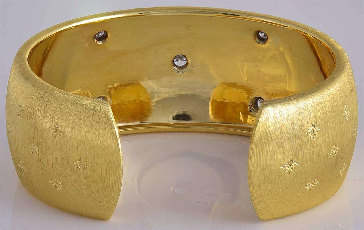 Shimmering 18K yellow and white textured cuff bracelet. Made & signed by Buccellati. Set with seven round brilliant cut diamonds. Hinged closure,. Handmade in Italy.  A beautiful classic bracelet.

Alice Kwartler has sold the finest antique