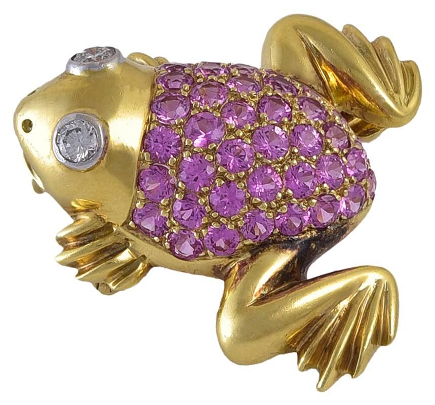 Bright and beautiful figural frog pin.  18K yellow gold with diamond eyes.  The whole body is comprised of brilliant faceted pink sapphires.  1