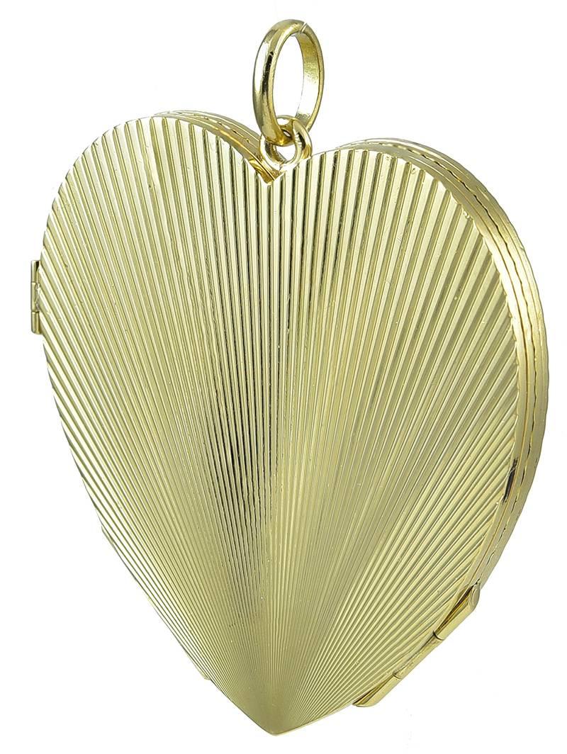 Best ever four-picture figural heart locket. Opens to a large four-leaf clover. Deep deco lines engraved front and back. Heavy gauge 18K yellow gold weighing 64 grams. 2