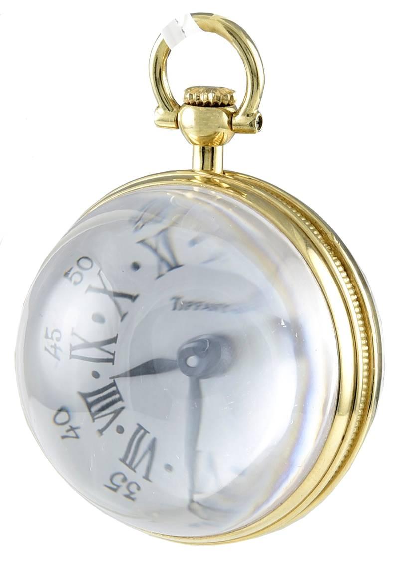 Most interesting and attractive crystal clock pendant.  Made and signed by TIFFANY & CO.  Round ball clock, with skeleton back.  The movement is by Chopard.  17 jewels.  1 1/4