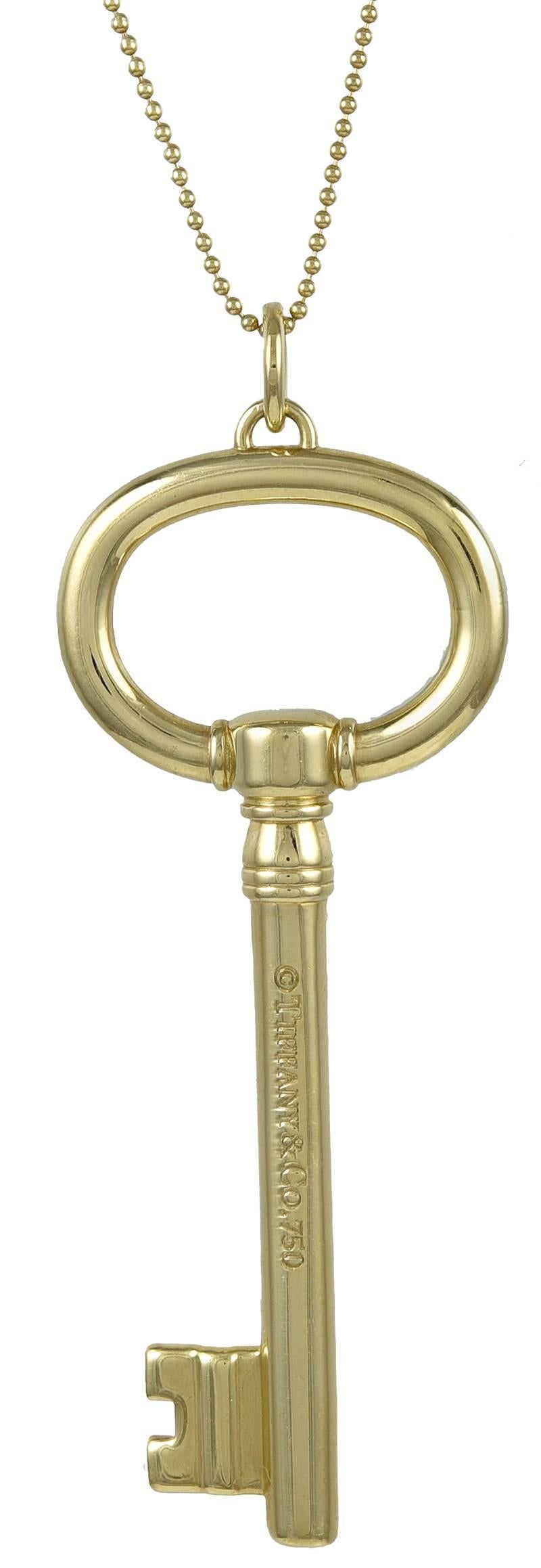 Large figural key pendant.  Made and signed by TIFFANY & CO.   18K yellow gold.  2 1/2