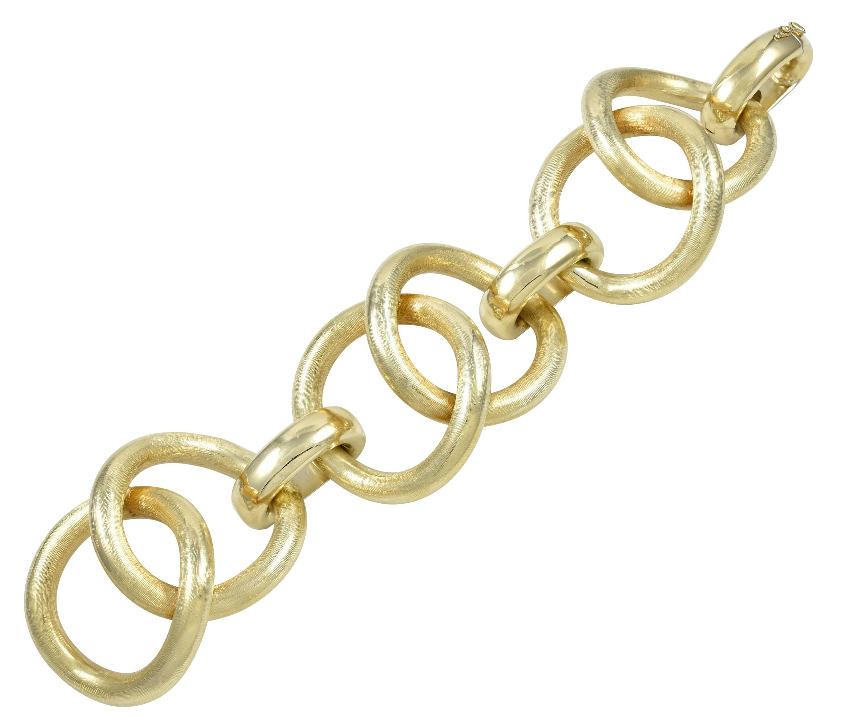 Fabulous 18K yellow gold bracelet.  Textured gold huge links attached by shiny gold oval connecting loops.  8 1/4