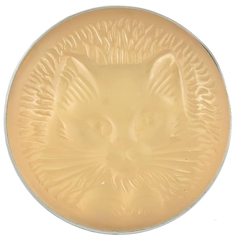 Crystal brooch. Made and signed by LALIQUE.  Portrays a beautiful cat's face, whiskers and paws.  Looks luminous -- lit from within.  On metal backing, with pin.  1 7/8