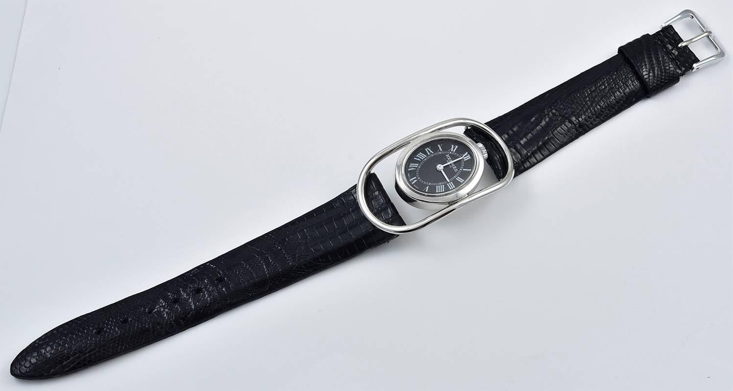 Sleek striking openwork wrist watch.Made and signed by HERMES Paris.  Black face with Roman numerals.  Top-wind; mechanical movement. Made in 1971.  2