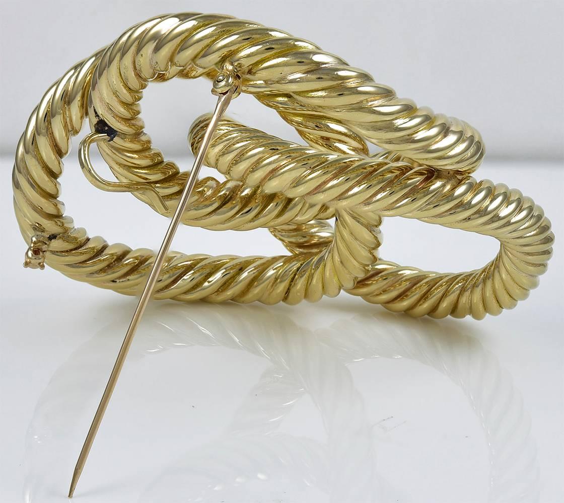 Striking large brooch, with a rope twist design.  14K yellow gold.  3 1/2