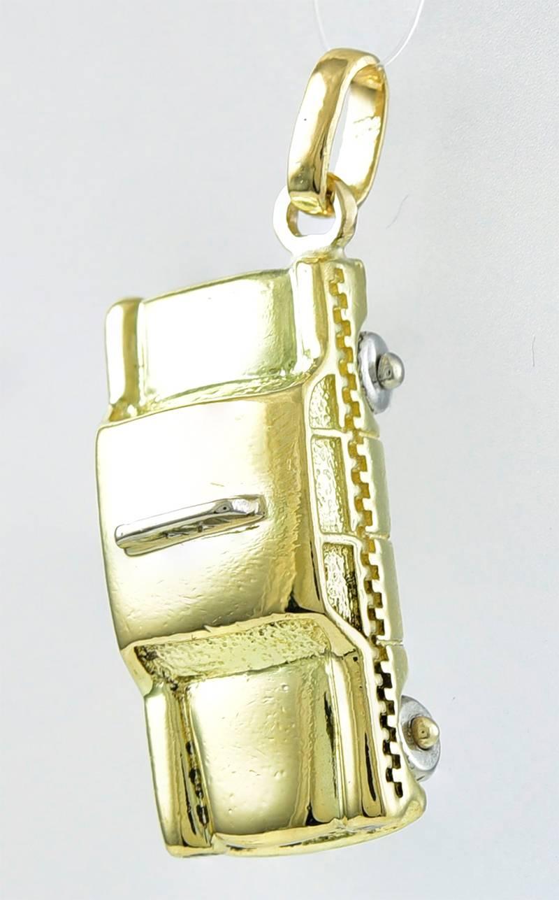 Figural taxi cab charm.  Made and signed by TIFFANY & CO.  No longer available at Tiffany.  18K yellow gold.  Excellent detail.  A prized rare charm -- an old checker cab, with wheels that spin around.

Alice Kwartler has old the finest antique