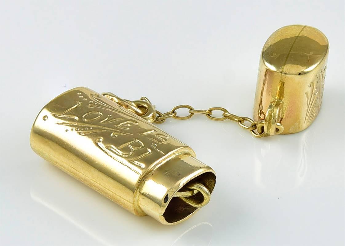 Great moveable charm:  14K yellow gold case, with embossed leaves, engraved 