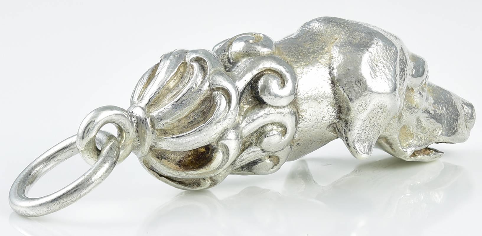 The best ever dog whistle:  a sterling silver figural dog head.  Made and signed by TIFFANY & CO.  Marked 