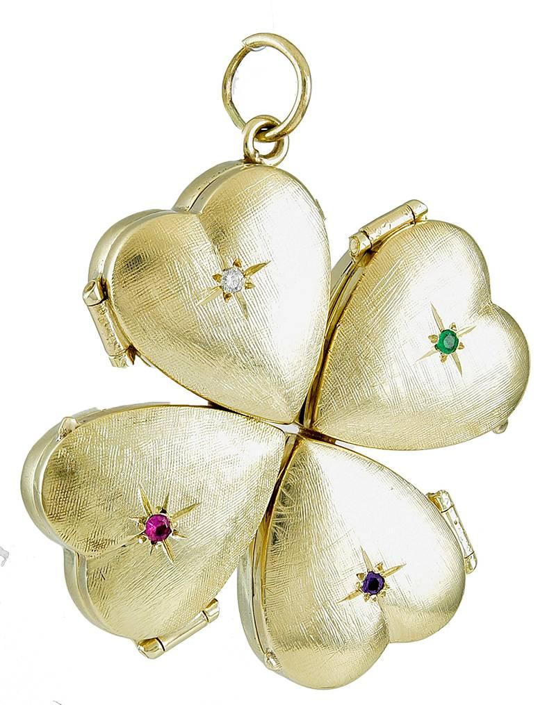 Exceptional figural heart locket, for four pictures.  14K yellow gold with a textured satin finish.  This is a 