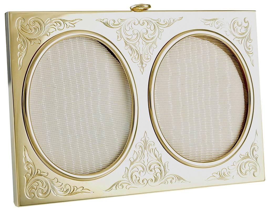 Exquisite picture frame for two photographs.  14K yellow gold with fine hand-engraved leaves around each picture.  Overall size of frame is 4 1/2