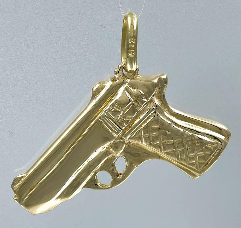 Figural "pistol" charm.  Extra-heavy gauge 14K yellow gold.  Weighty and chunky.  Large size -- 2 1/8" x 1."  Combination of matte and shiny gold.  Very realistic.

Alice Kwartler has sold the finest antique gold and diamond