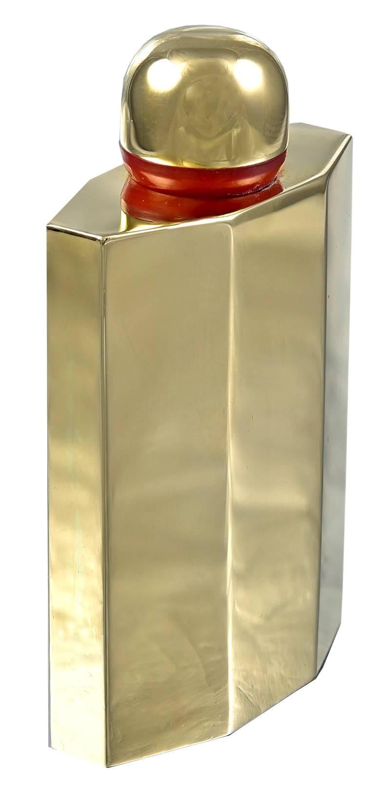 Elegant miniature perfume bottle. 14K yellow gold, with beautiful beveled pattern.  Original glass liner and long dabber.  Carnelian collar.  2 1/4