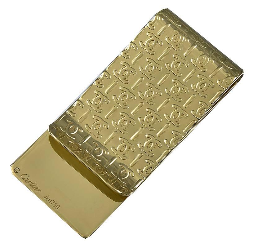 Great money clip.  Made and signed by CARTIER.  18K yellow gold.  Allover engraved, front and back, with the Cartier logo.  2 1/2" x 1."  A sleek, elegant, prestigious object.

Alice Kwartler has sold the finest antique gold and diamond