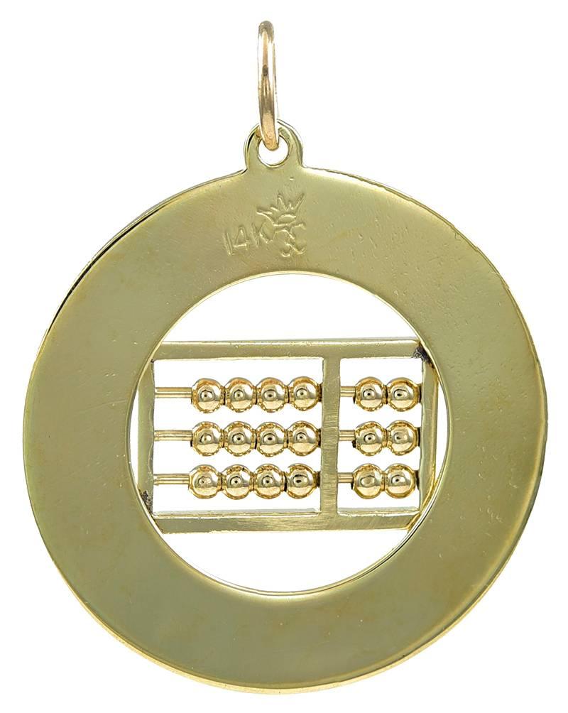 Large charm.   Applied letters around the border spell out in French "How Do I Love Thee?  Let Me Count The Ways" on a textured  14K yellow gold background.  Figural "abacus" in the center.  1 1/3" in diameter. 