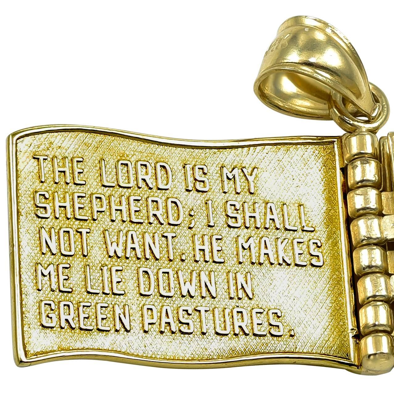 A lovely charm that opens like a book.  On the front, in applied letters,  is written "The Lord Is My Shepherd."  The following pages contain the rest of the 23rd Psalm.  14K matte and shiny yellow gold.  Has a small clasp to keep the book