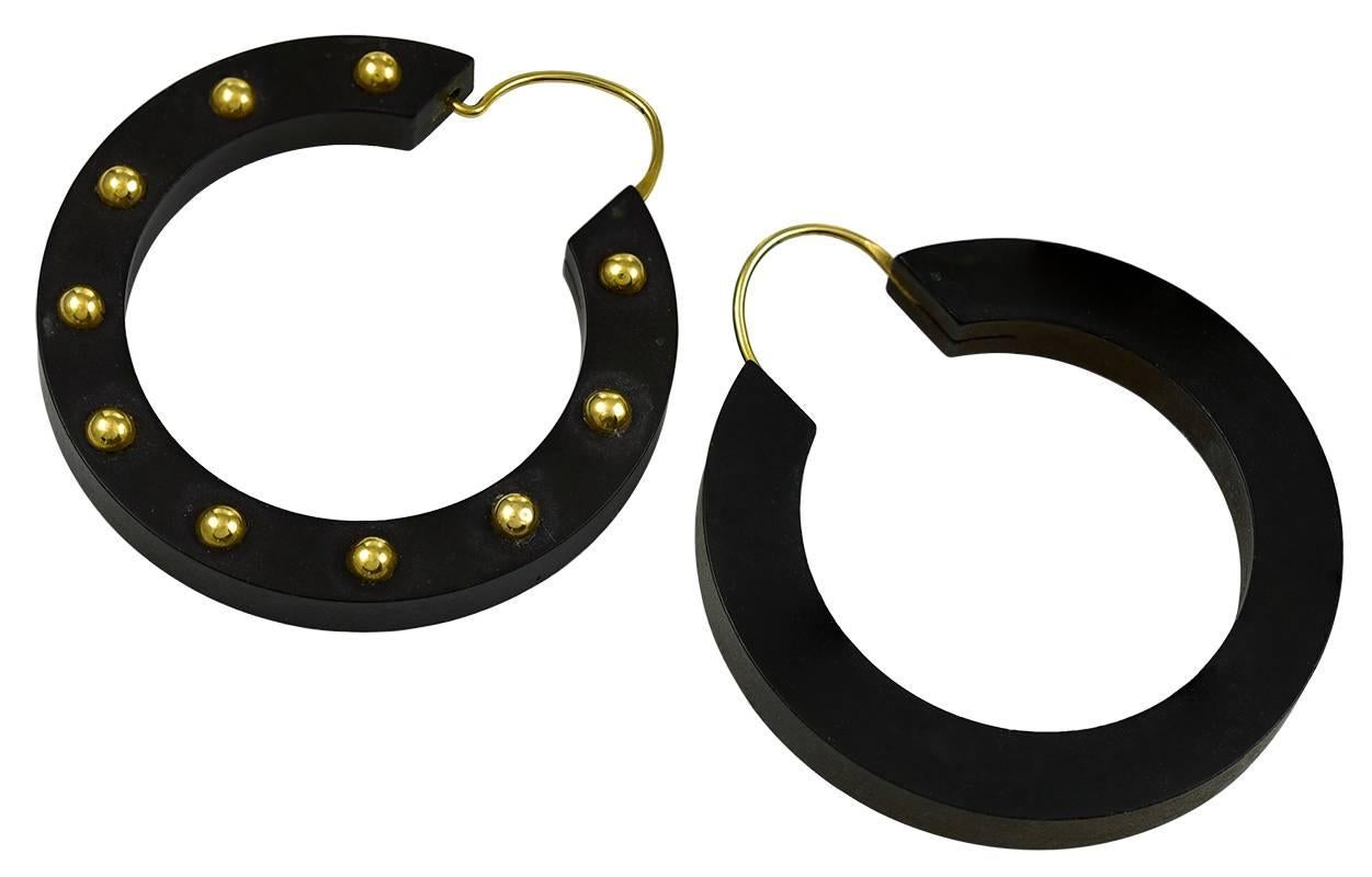 Chic and antique gutta percha hoop earrings;  set with 14K yellow gold applied dots, and gold hoop closures, 1 1/3