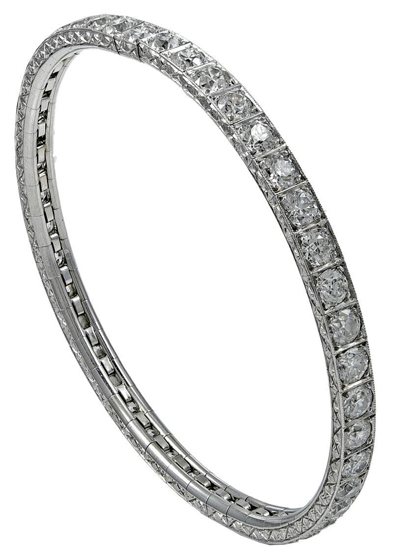 A superb diamond bracelet that is brilliant to look at and effortless to wear:
it is a stretchy flexible bracelet that easily slips over the wrist, with no clasp involved.  Comprised of 11.5 carats of round brilliant diamonds (G-H color, VS