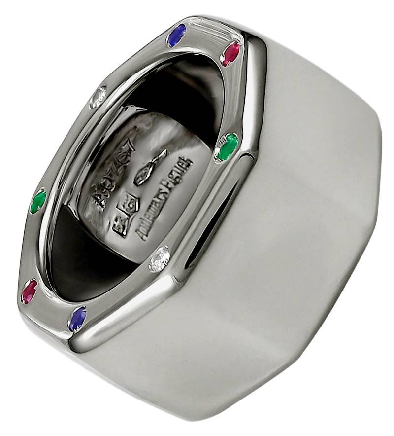 Chic 18K wide gold band.  Made and signed by AUDEMARS PIGUET in the "Royal Oak Off Shore" pattern.    Beveled all around, so that it hugs the finger.   Set top and bottom with bright faceted, diamonds, rubies, emeralds and sapphires.  size
