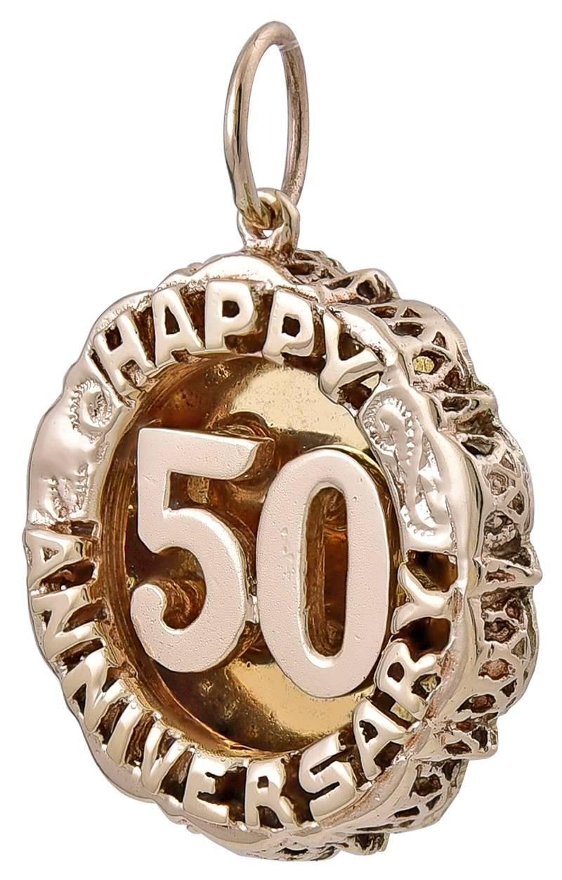 Three-dimensional charm.  Raised letters around the border spell out "HAPPY ANNIVERSARY."  There is an applied "50" in the center.  14K heavy gauge yellow gold.  1" in diameter.  

Alice Kwartler has sold the finest antique