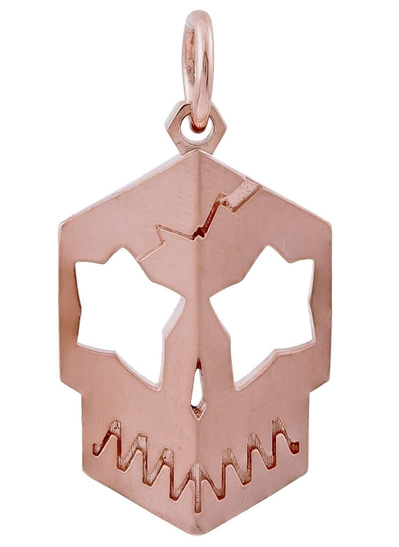 Fierce figural "skull" pendant.  Heavy gauge 14K rose gold.  A chunky moderne take on a classic.  1 1/2" x 7/8." 

Alice Kwartler has sold the finest antique gold and diamond jewelry and silver for over forty years.