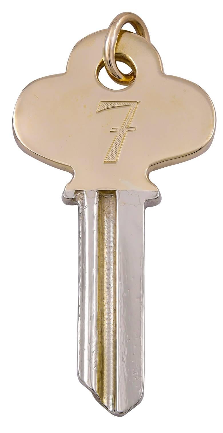 Figural "key."  Made, signed and numbered by CARTIER.  The top is 14K yellow gold, engraved on both sides with a "Lucky 7."  The bottom is metal, which a locksmith can custom cut for you.  2" x 1."  A great gift.

Alice