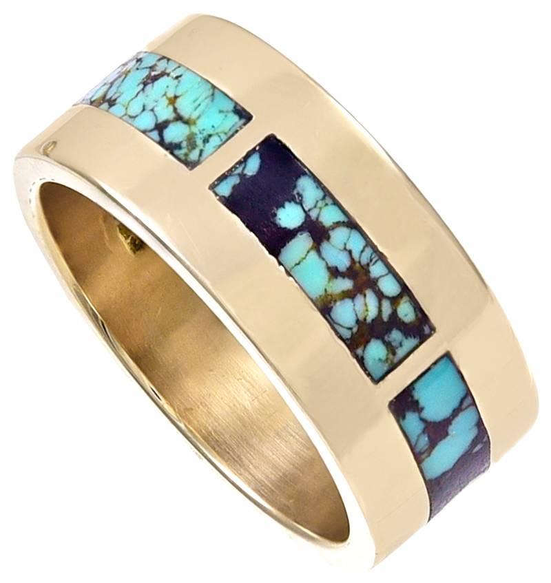 Very handsome and compelling ring.  14K rosy gold, with inlaid panels of turquoise.  Size 10.  A distinctive beautiful look;  a silky feel; the turquoise inlay is flush with the surface.

Alice Kwartler has sold the finest antique gold and diamond