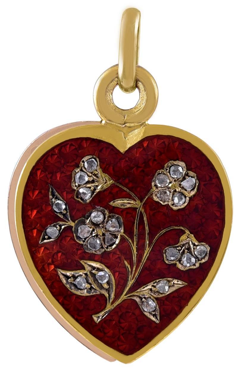 Gorgeous antique locket:  a figural "heart" in 22K gold.  Brilliant red guilloche enamel, with a graceful floral pattern, set with rose-cut diamonds.  Slide mechanism, which opens to reveal space for a photograph.   3/4" x