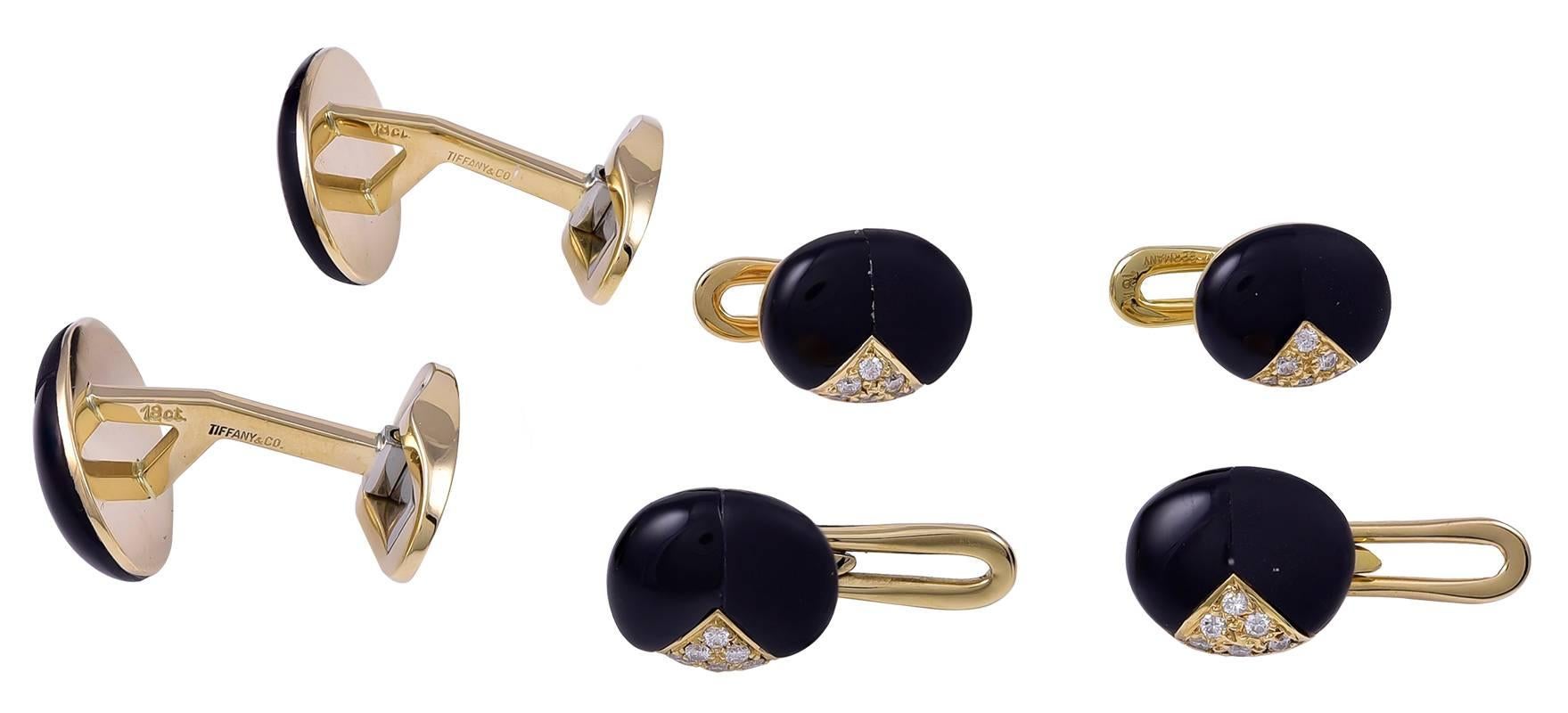 Very handsome and distinguished men's dress set.  Made and signed by TIFFANY & CO.  Heavy gauge 18K yellow gold.  The fronts are onyx; visually very interesting because half of the onyx has a shiny polish and the other half has a matte satin