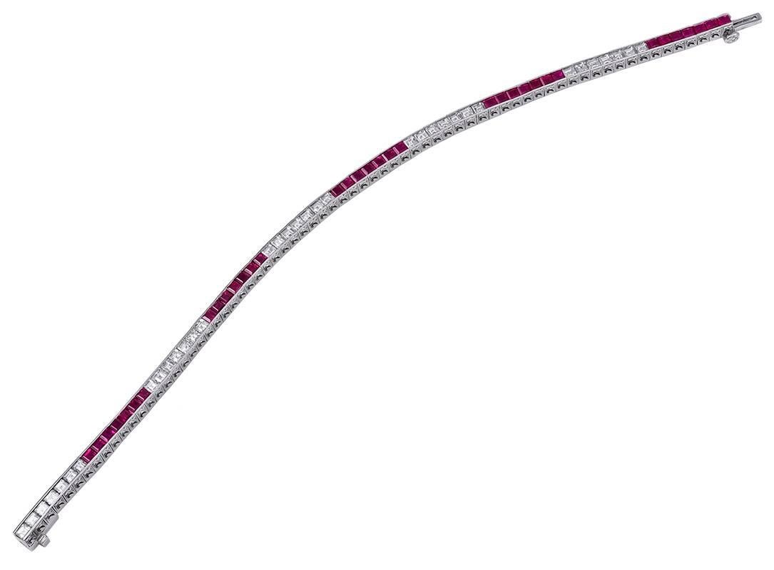 Luminous ruby and diamond line bracelet.  Made and signed by TIFFANY & CO.
Set in platinum; the sides of the links are finely engraved.  Approximately 3.50       
carats of sparkling Square step-cut diamonds and 4.25 carats of brilliant Square