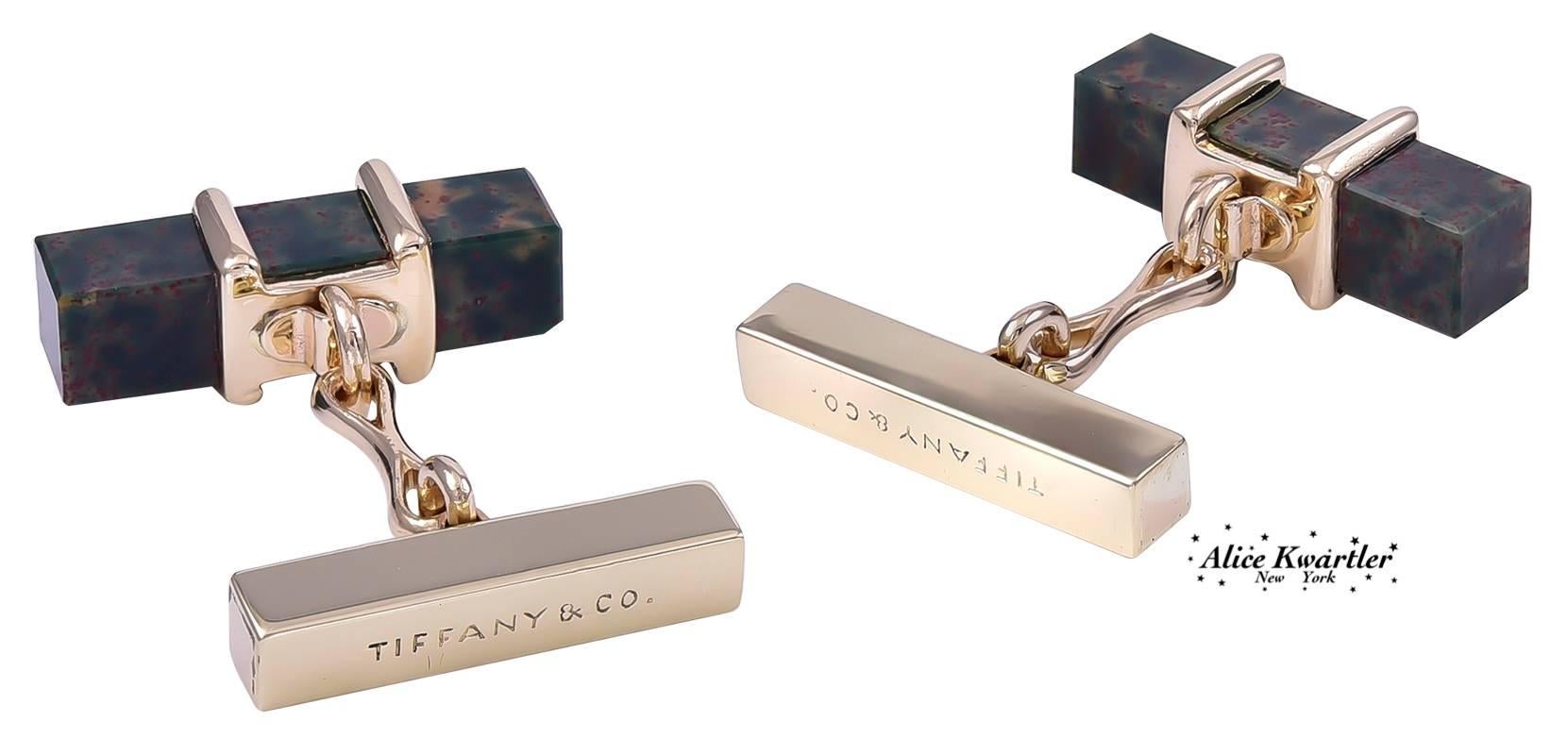 Masculine square bar-shaped cufflinks.  Made and signed by TIFFANY & CO.  14K yellow gold, wrapped around a square bar of bloodstone.  3/4" long.  Distinctive and handsome.

Alice Kwartler has sold the finest antique gold and diamond