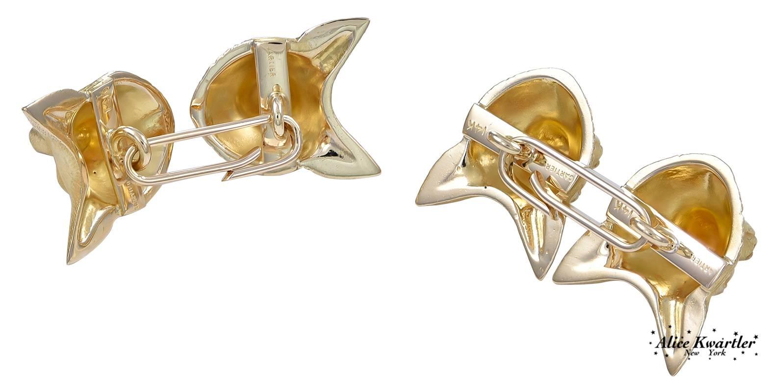 Superb double-sided figural "fox head" cufflinks.   Made and signed by CARTIER.  Finely detailed faces, set with bright faceted ruby eyes.  Heavy gauge 14K yellow gold.  Absolutely outstanding.

Alice Kwartler has sold the finest antique