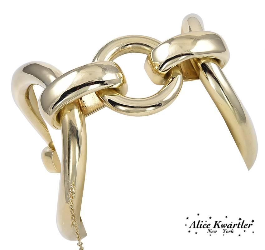Great bold bracelet.  One large oval link on top and bottom, with  smaller connecting links.  18K yellow gold.  8 1/2" long.  A strong, moderne fabulous look.

Alice Kwartler has sold the finest antique gold and diamond jewelry and silver for