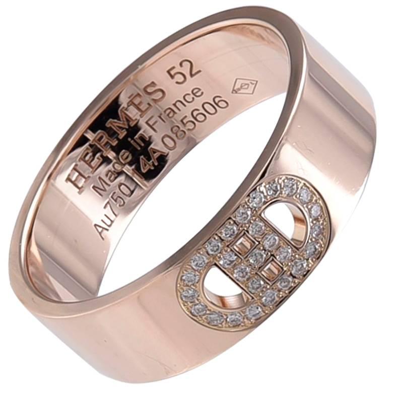 Iconic H d' Ancre ring.  Made and signed by HERMES.  This design was inspired by a ship's anchor.  18K rose gold, set with diamonds.  French size 52 or U.S. 6.  Small model, 1/4" wide.  Can be worn stacked or alone.  Sporty and chic.

Alice