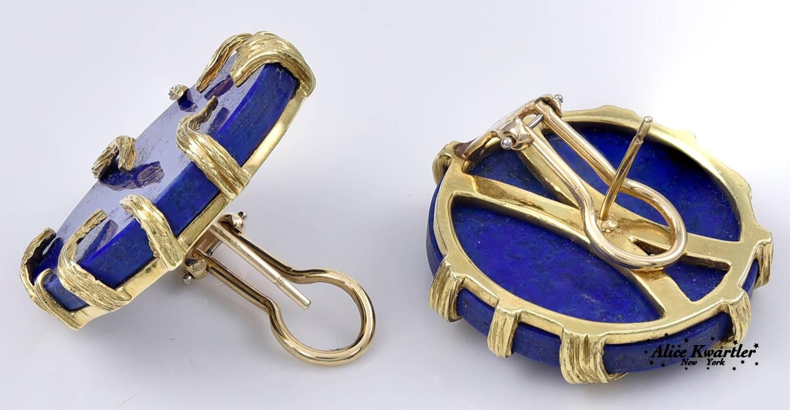 Chic lapis lazuli round earrings, with applied gold leaf motif. Good color lapis, with a lot of natural gold flecks.  1" in diameter.  14K yellow gold. Omega clips with posts.  A most interesting distinctive earring.

Alice Kwartler has sold
