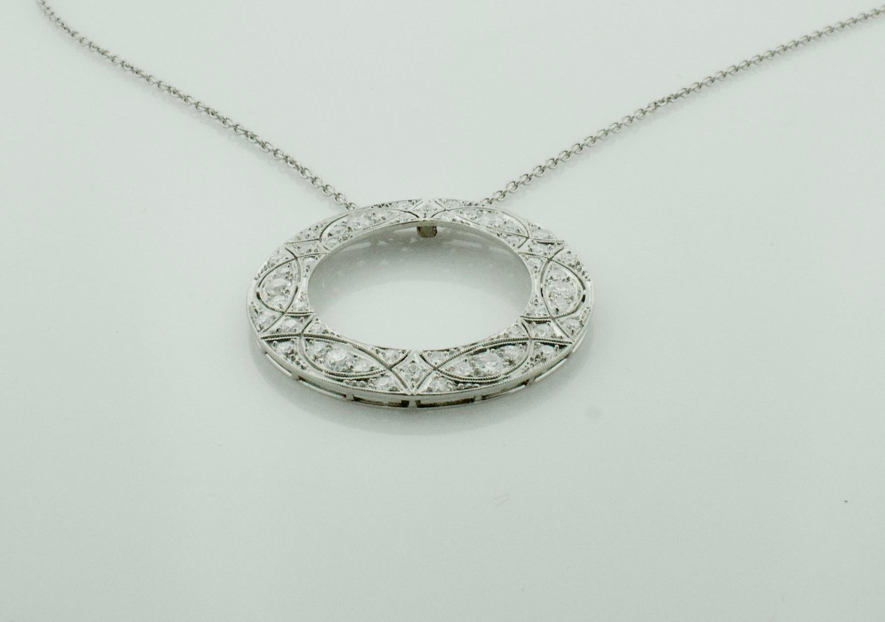 Introducing our stunning Art Deco Platinum Diamond Circle Necklace, a true masterpiece from the 1920s. With a total carat weight of 2.30 carats, this necklace is an exquisite example of fine craftsmanship from a master of the era.

The necklace