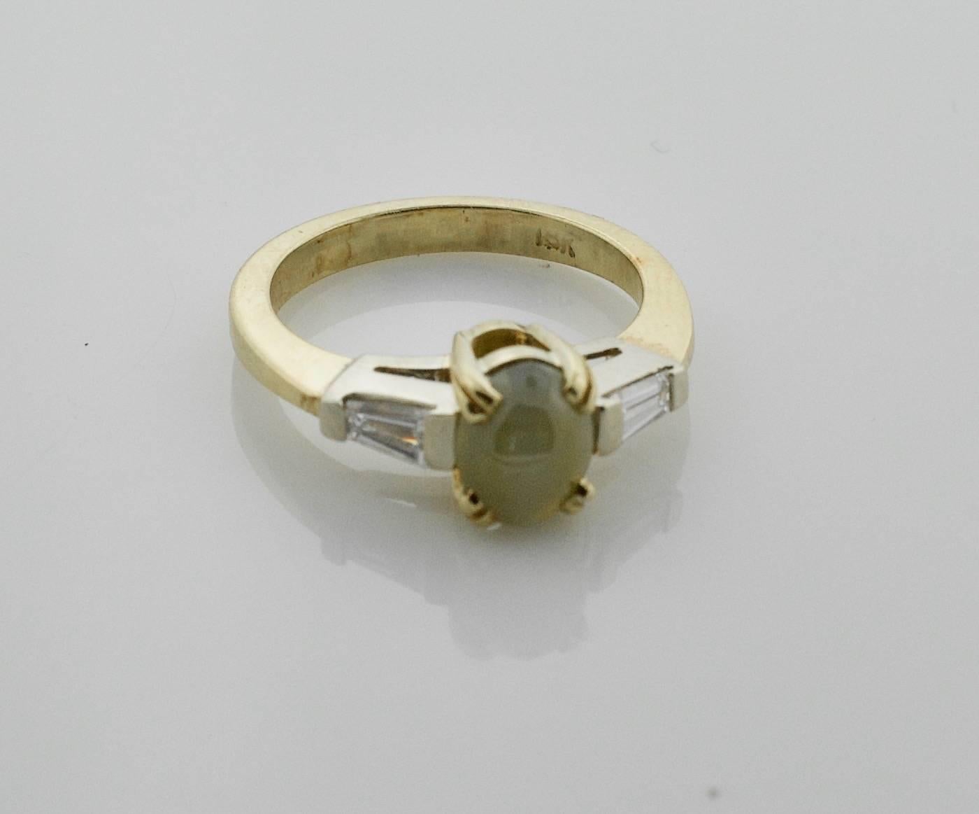 Oval Cut Cats-Eye and Diamond Ring in 18 Karat For Sale