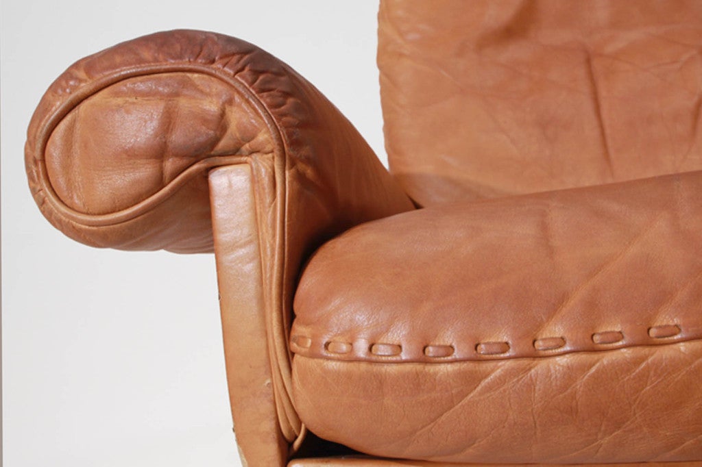 Swiveling caramel leather armchair and ottoman by De Sede at 1stDibs